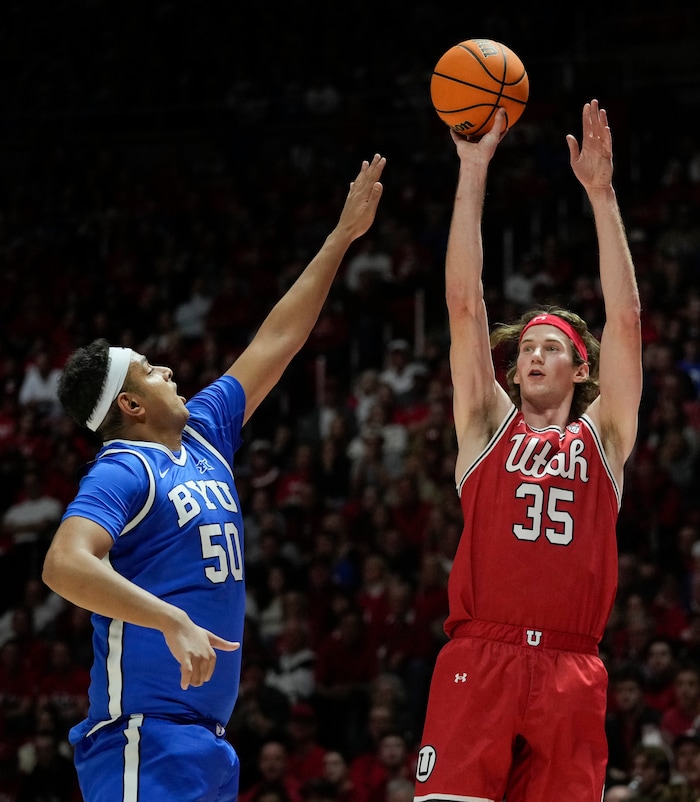 (Bethany Baker  |  The Salt Lake Tribune) Utah Utes center Branden Carlson (35) shoots as Brigham Young Cougars center Aly Khalifa (50) blocks at the Jon M. Huntsman Center in Salt Lake City on Saturday, Dec. 9, 2023.