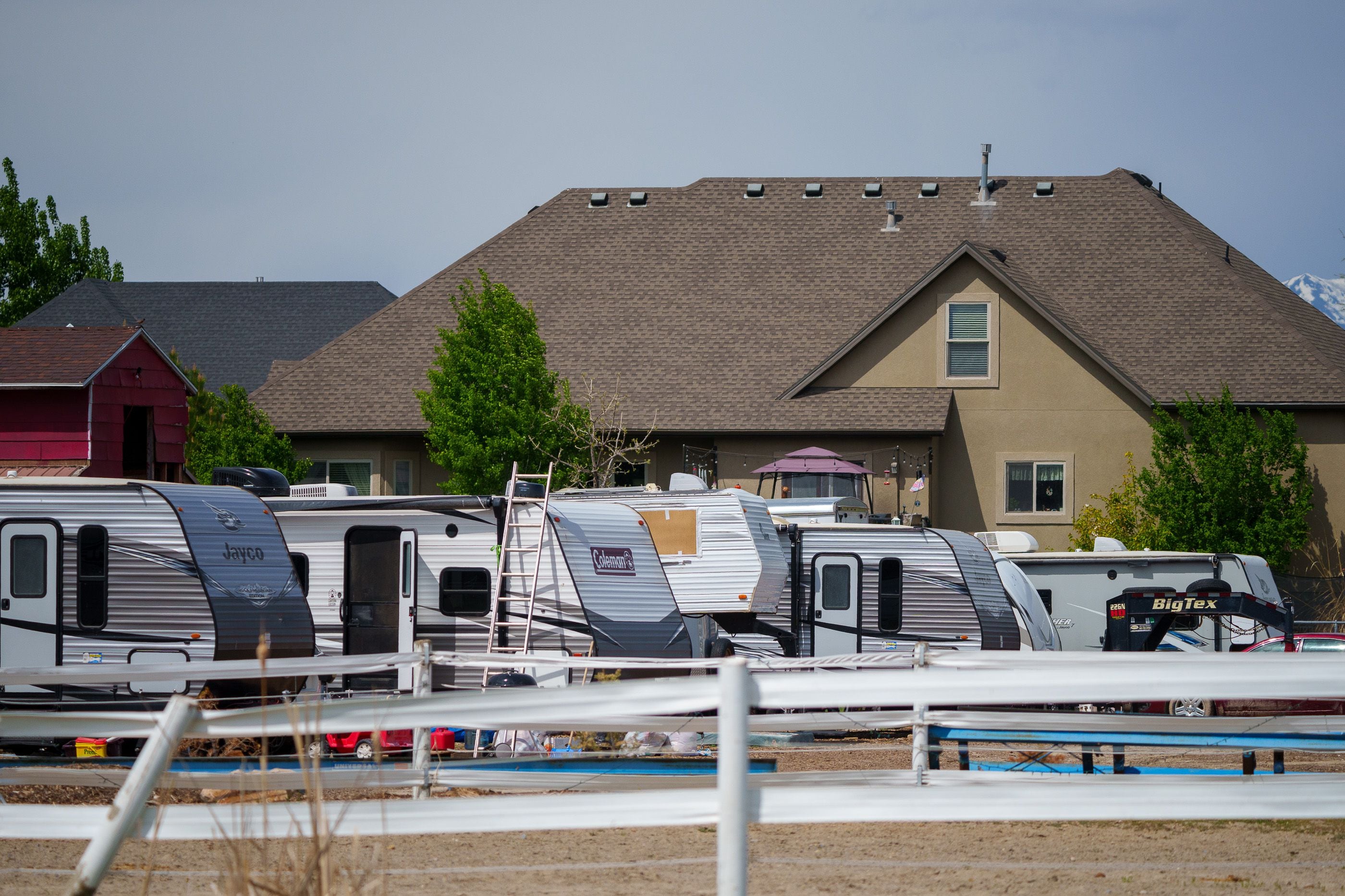 (Trent Nelson | The Salt Lake Tribune) Motor homes parked at the Lehi Farmers Market property in Utah County on Saturday, May 13, 2023.