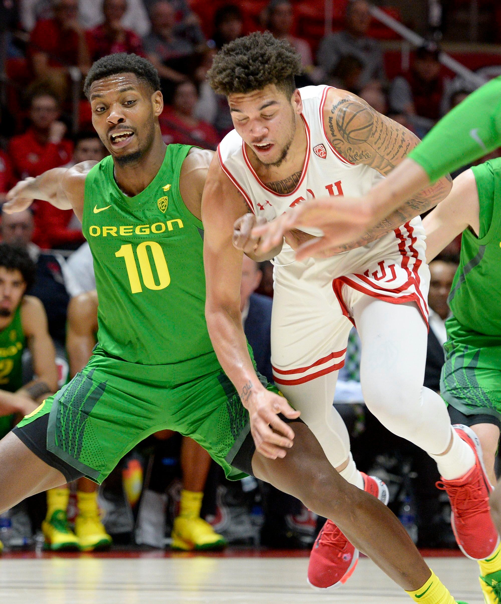 (Leah Hogsten | The Salt Lake Tribune) Oregon Ducks forward Shakur Juiston (10) and Utah Utes forward Timmy Allen (1) battle at the foul line as the University of Utah basketball team hosts No. 4 Oregon, Jan. 4, 2020, at the Huntsman Center.