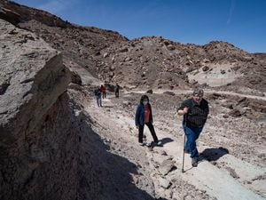 (Francisco Kjolseth  | The Salt Lake Tribune) State Sen. Jani Iwamoto, center, and Utah Paleontologist Jim Kirkland tour the site of the new Utahraptor State Park. Iwamoto was the co-sponsor of the legislation creating the park, which contains the largest array of dinosaur species on the planet. It is also the site of a World War II Japanese isolation camp that will be memorialized within the park. 