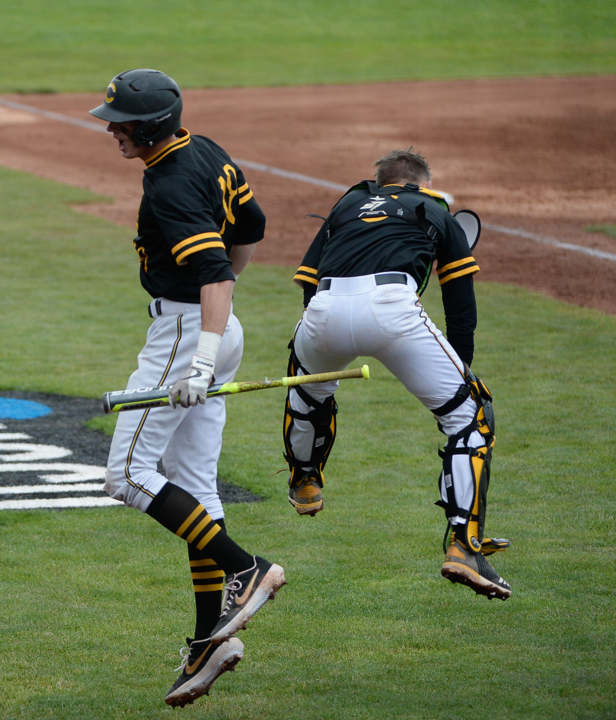 (Francisco Kjolseth | The Salt Lake Tribune) Cottonwood's Dylan Reiser, left, celebrates a run with teammates during the 5A baseball championship game at UCCU Stadium on the UVU campus in Orem, Friday, May 24, 2019.