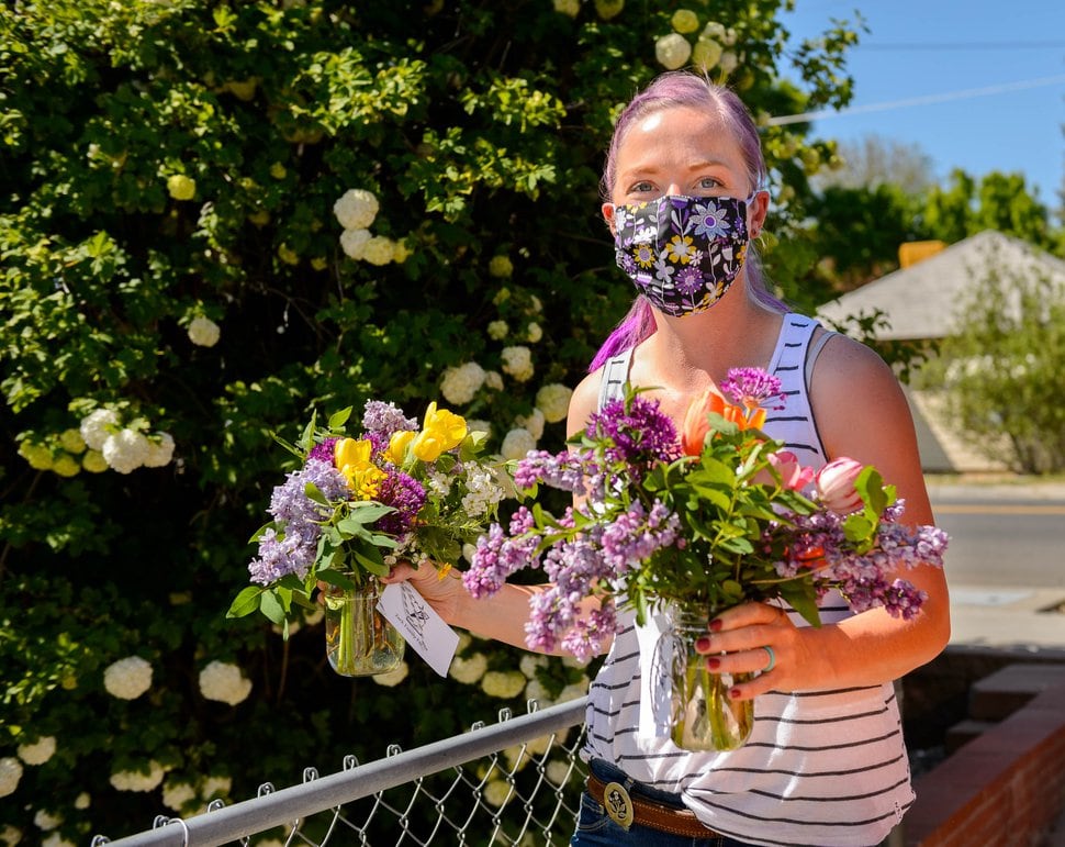 (Trent Nelson | The Salt Lake Tribune) Anna Zack, co-founder of Zack Family Farms, makes Mother's Day deliveries in Ogden on Saturday, May 9, 2020. Anna and Ben Zack started Zack Family Farms last fall with hopes of selling flowers to florists for weddings. But during COVID-19, they had to adapt and are now making home deliveries with their flowers.