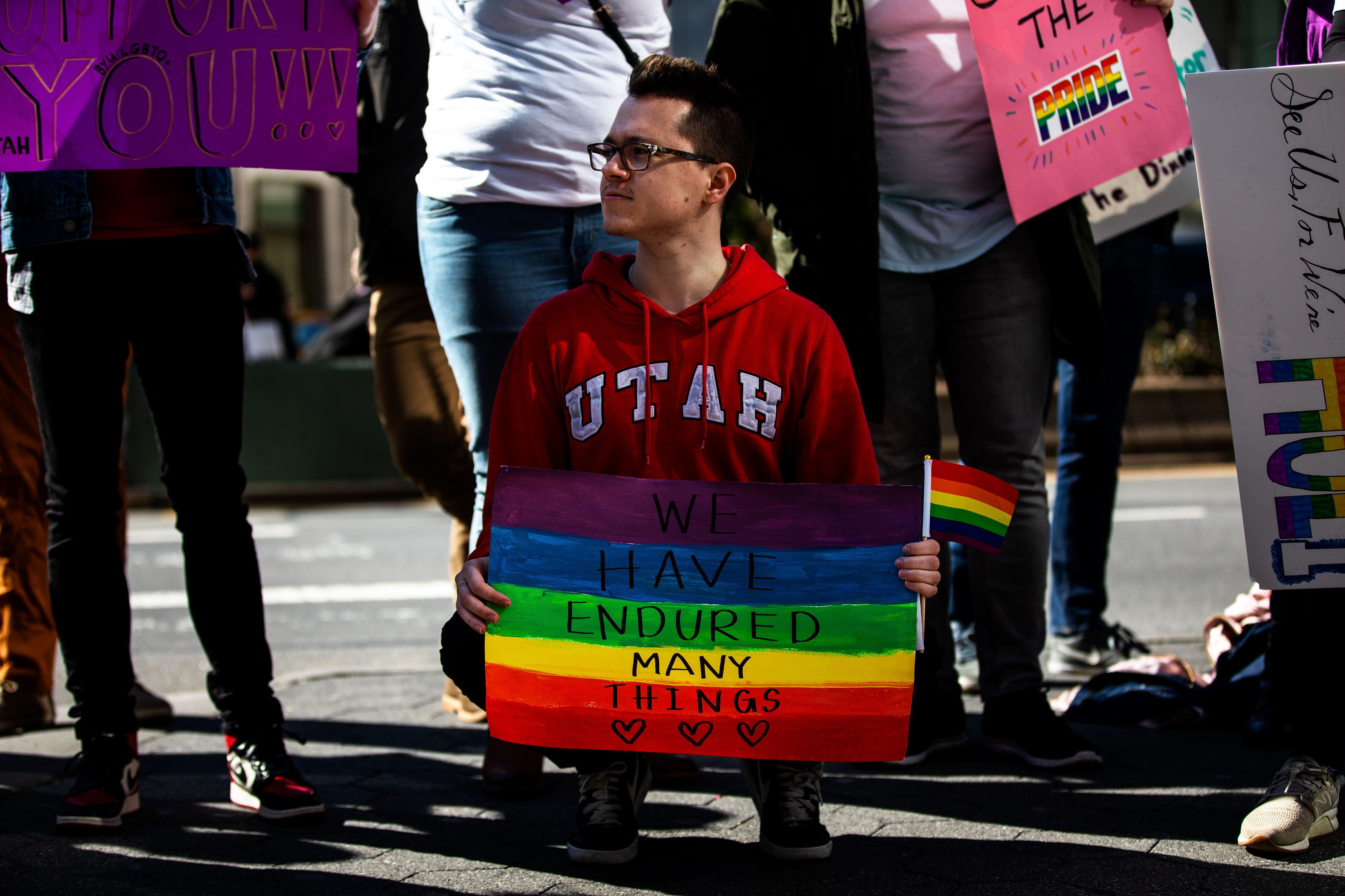 (Demetrius Freeman | for The Salt Lake Tribune) Browne Sebright, 24, chants with current and former members of The Church of Jesus Christ of Latter-day Saints, the LGBTQ+ community, and supporters protest at Lincoln Square across from the Latter-day Saints temple in Manhattan on Saturday, March 7, 2020. BYU reinstated policies in its student handbook that prohibit "homosexual behavior."