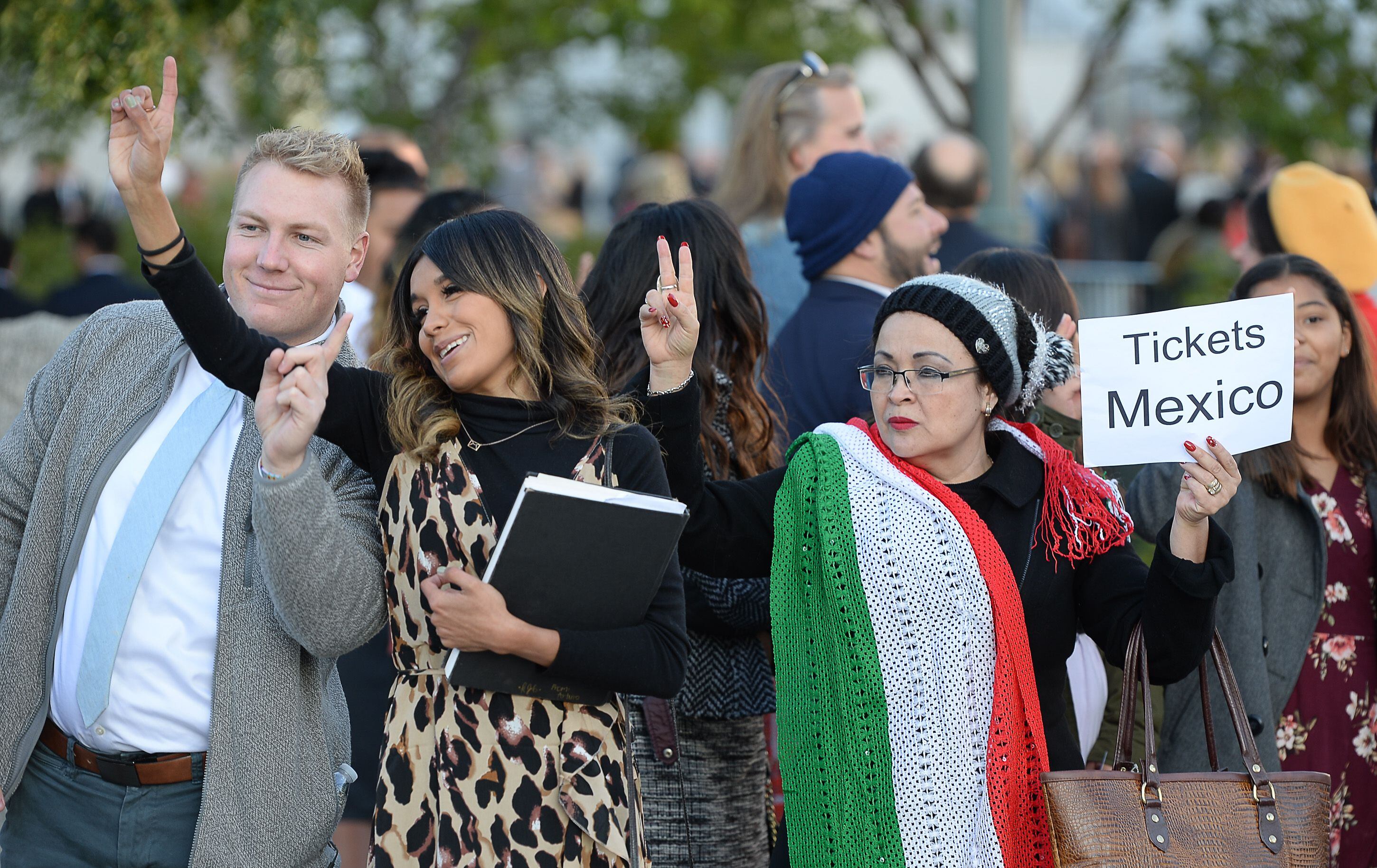 (Francisco Kjolseth | The Salt Lake Tribune) Jake Schoeneman, Karina Galicia and Merlita Casillas, from left, try for an entry ticket as people arrive for the Sunday session of the 189th twice-annual General Conference of The Church of Jesus Christ of Latter-day Saints at the Conference Center in Salt Lake City on Sunday, Oct. 6, 2019.