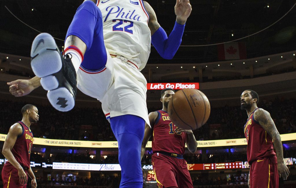 Philadelphia 76ers' Ben Simmons (25) reacts after dunking the ball